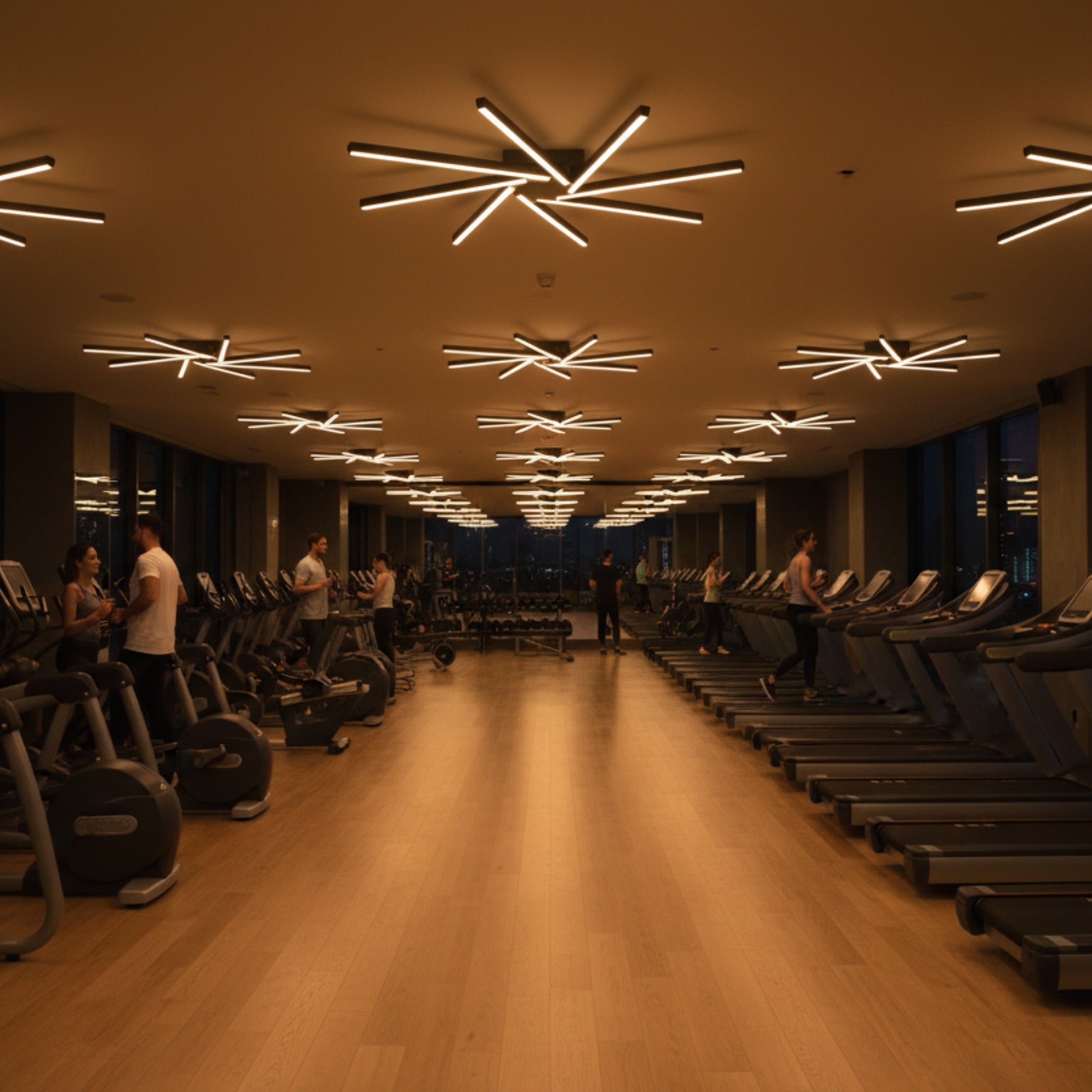 Modern gym aydınlatmasında Zenit siyah LED avize ile motivasyonu artıran sıcak ışık.