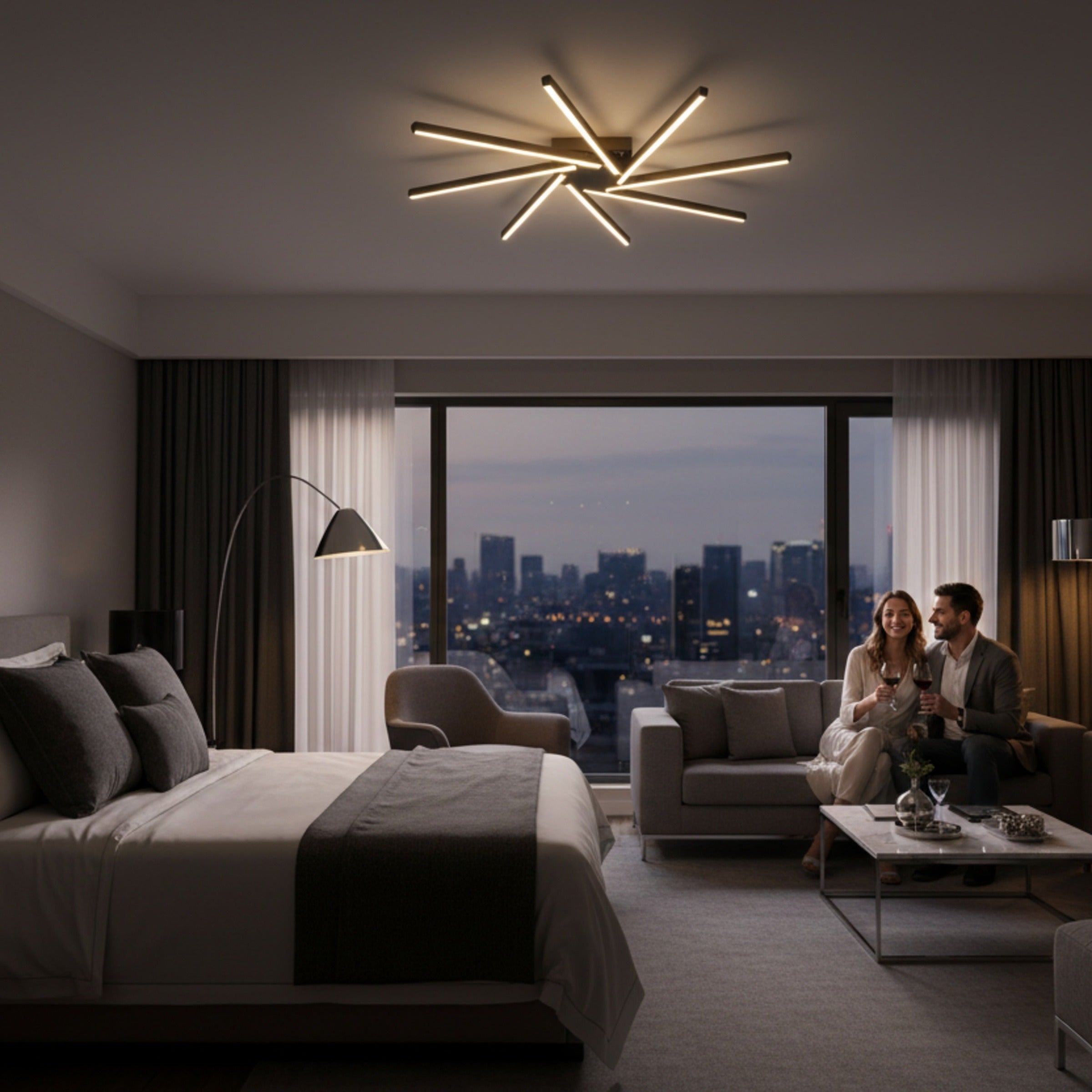 Gece manzaralı lüks otel odasında Zenit modern LED avize ve dinlenen çift.